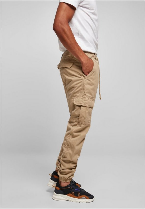 Męskie spodnie Urban Classics Cargo Jogging Pocket — beżowe
